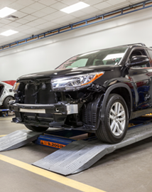 Toyota on vehicle lift | Acton Toyota of Littleton in Littleton MA